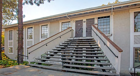 Exterior stairway leading to second-floor suite entrance